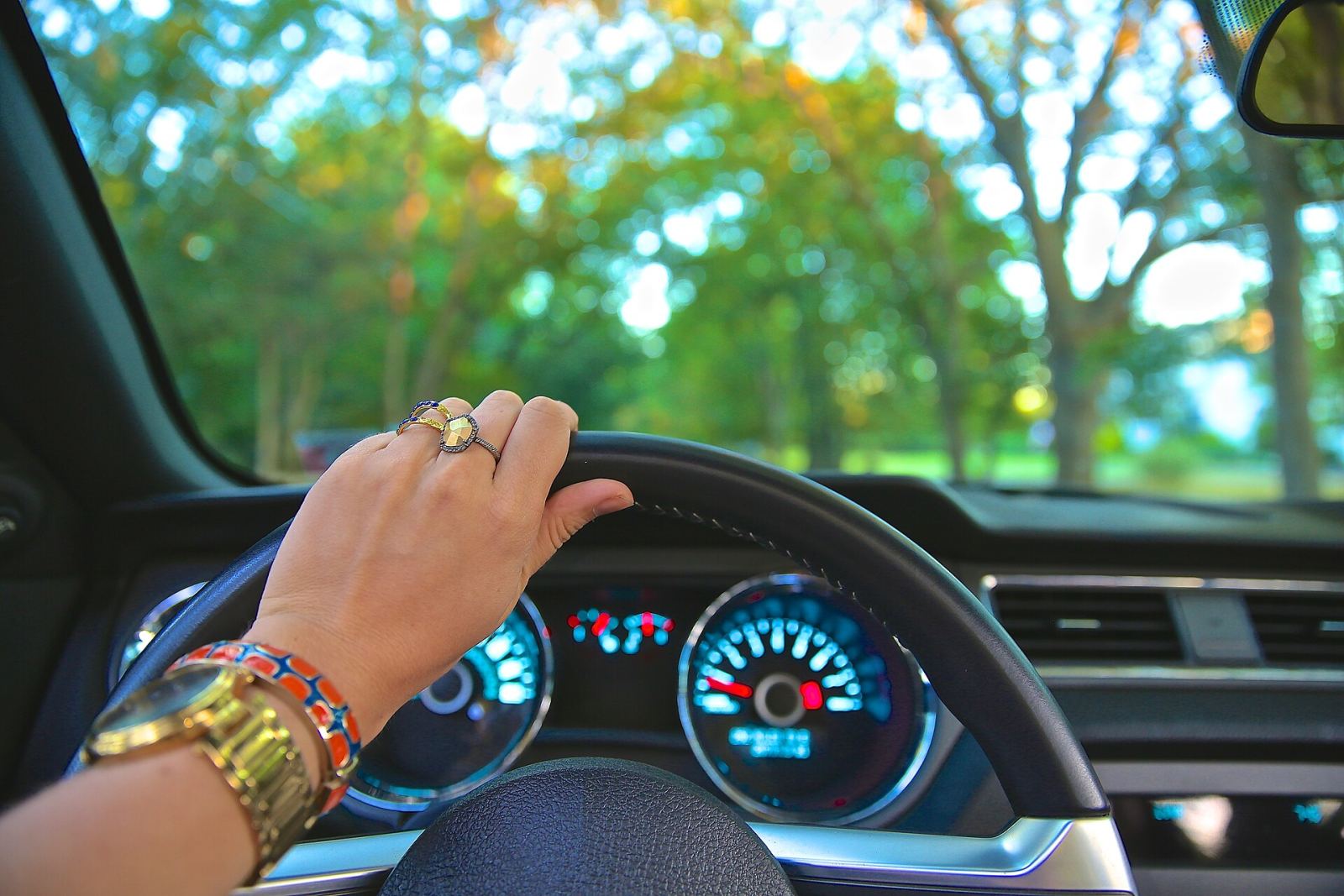 A hand on the steering wheel during an automatic driving lesson in West Bromwich