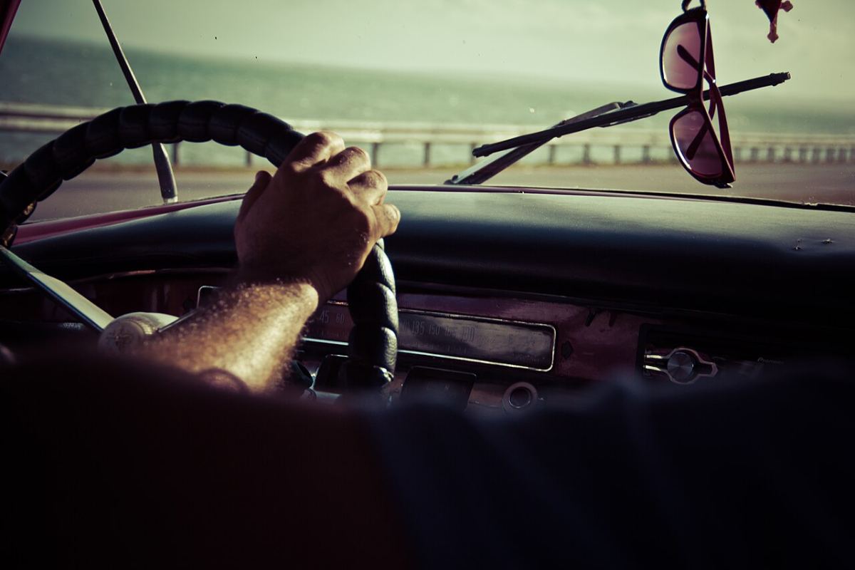 A learner driver with both hands on the steering wheel