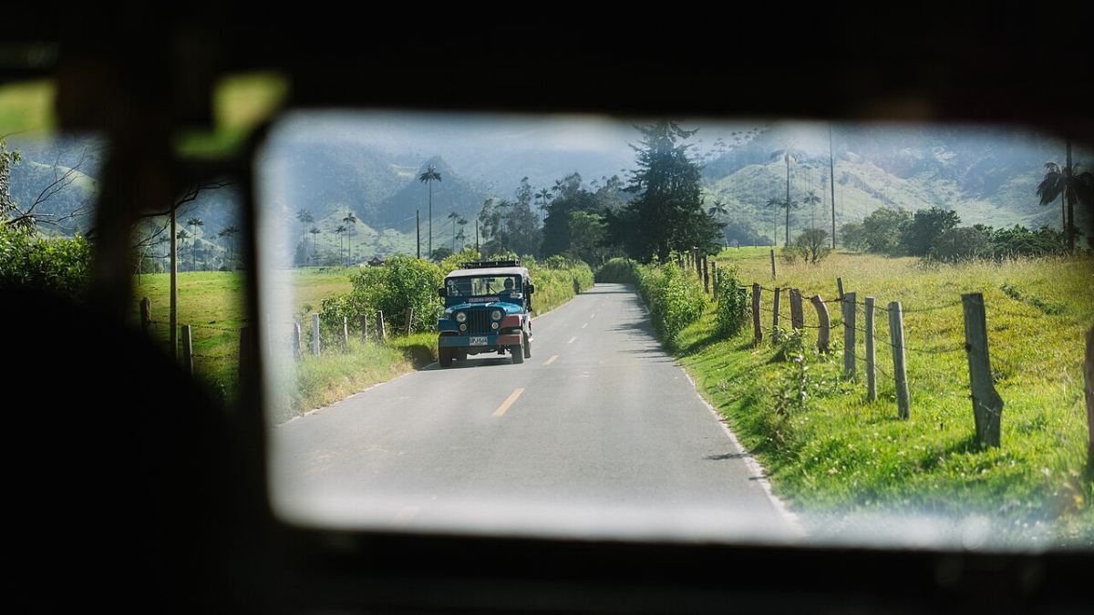 A learner checking the mirror before moving off