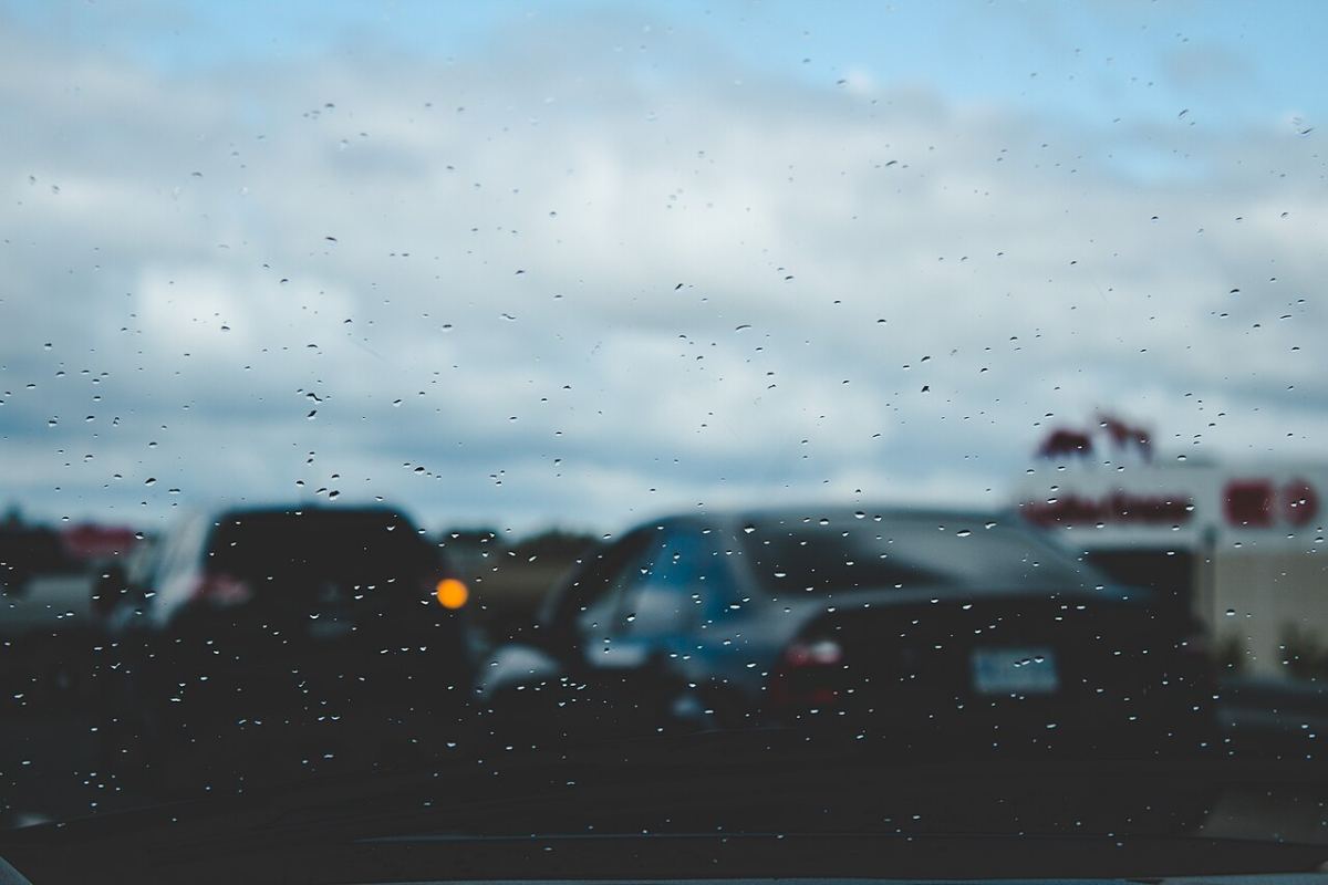 Traffic seen through a rainy windscreen