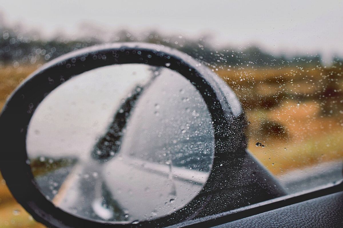 A wing mirror in the rain